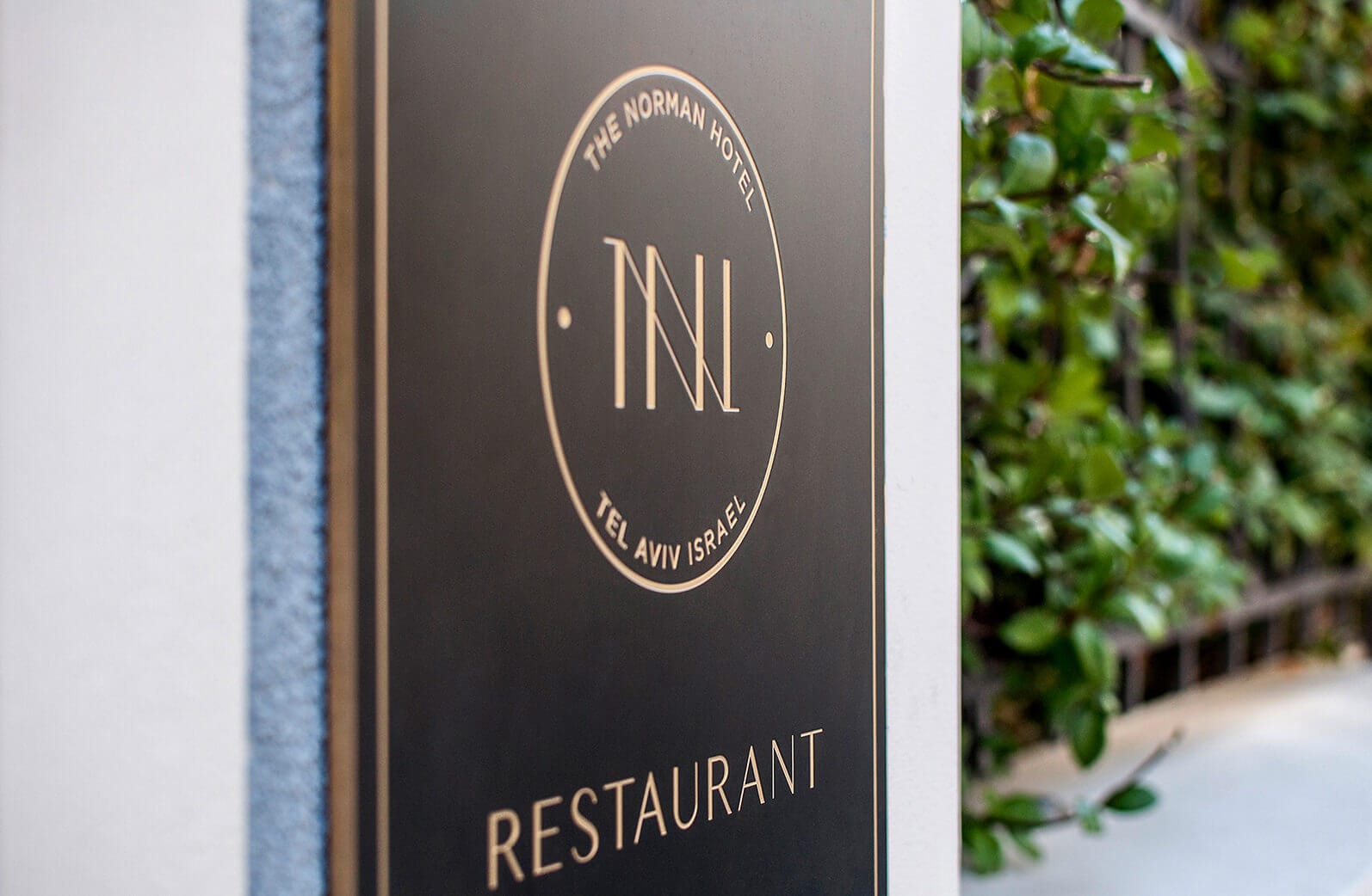 Anders brand wordmark in white placed on top of an image of a modern interior design.